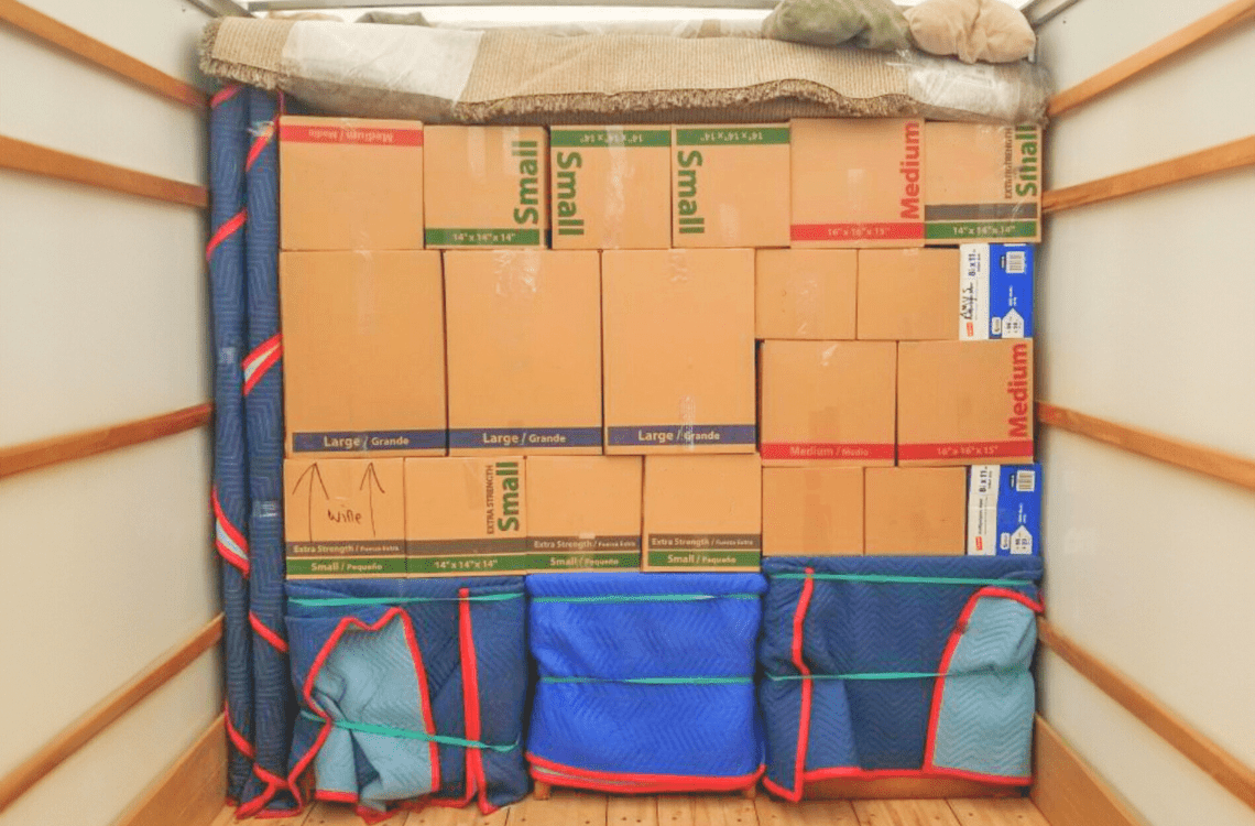 Neatly packed Ruff and Ready Moving truck showing organized boxes and secured items