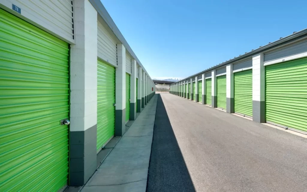 A row of storage lockers with green doors